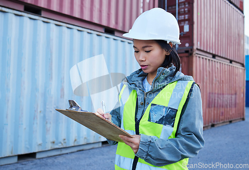 Image of Logistics, shipping and asian woman engineer writing checklist report for inspection or delivery control of cargo containers at shipyard. Supply chain worker in safety helmet at a warehouse in Korea