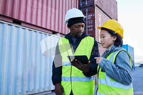 Image of Logistics, supply chain and shipping team with tablet planning delivery schedule online at a port. Cargo or contractor in teamwork working with technology and container for transport or export