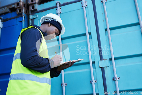Image of Warehouse, management and shipping logistics with man manager writing checklist for stock, delivery and inventory. Freight, supply chain and cargo control with black man checking ecommerce orders