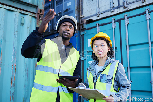 Image of Logistics, checklist and delivery manager in communication with industry worker stock, cargo and inventory inspection. Teamwork, woman and African man talking about export shipping containers report