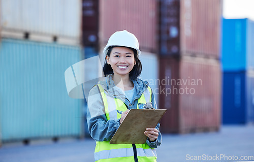 Image of Woman with clipboard, shipping and logistics check of stock at work site. Asian worker in transportation industry, smile in portrait with container in background and safety inspection of product.