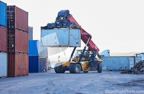 Image of Logistics, cargo and forklift with container with stock for delivery in an industrial port. Ecommerce worker working with transportation of manufacturing product with a crane at an outdoor warehouse