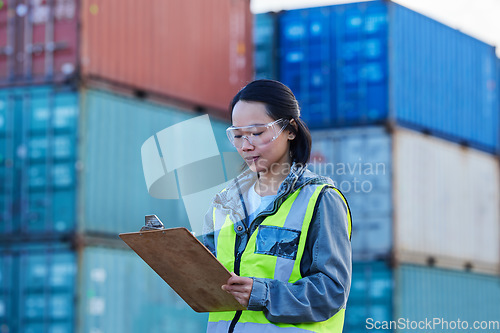 Image of Logistics, Asian woman and check containers, export and import for supply chain at shipyard with clipboard. Female supervisor, planning or confirm storage cargo shipping, strategy and global business