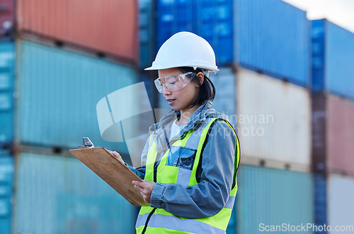 Image of Woman logistic worker, shipping checklist and working at shipyard freight container distribution port. Stock management, supply chain for import and export of international commercial cargo delivery