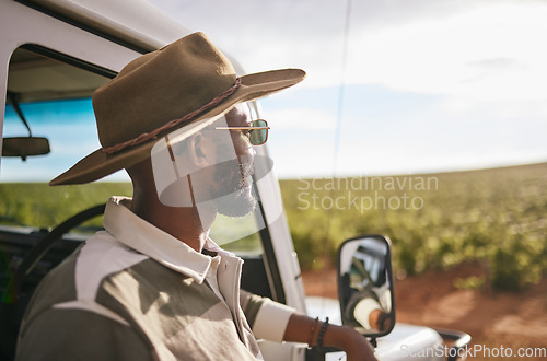 Image of Travel, road trip and a black man by a car for a holiday motor adventure. Calm and relax person looking at countryside nature taking a break from driving and transport outdoor in the summer sun