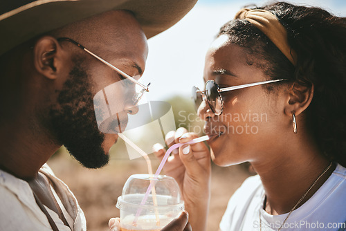 Image of Outdoor couple sharing straw drink, summer date and sunshine vacation together in Brazil. Young black people face, love and happiness to share drinking romance, relax and holiday fun in garden park