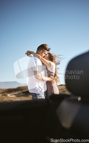 Image of Road trip, travel and couple kiss and hug for holiday, vacation or outdoor adventure with blue sky mock up advertising or marketing. Love, romantic people with car by countryside road summer mockup