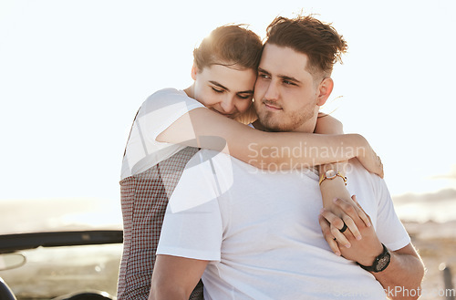 Image of Real couple hug, road trip and relax at sunset on a romantic driving vacation in Costa Rica together. Happy white man, woman travel the country in a car and holding hands at peace with a smile