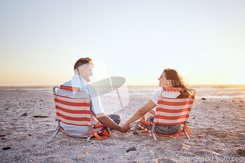Image of Love, relax and couple holding hands on the beach for comfort, peace and wellness while on Toronto Canada vacation. Mockup sky, sunset and bonding man and woman enjoy romantic quality time together