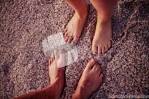 Image of Couple, feet and beach on wet sand for calm, relax and travel on summer vacation together in nature. Toes of people in relationship on sandy ocean for holiday traveling in the outdoors of Costa Rica