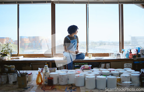 Image of Idea, creative and woman thinking while drawing with inspiration at a window in a studio. Indian artist, designer or creativity student with goal and vision for design job on paper at a workshop