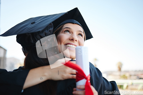 Image of Graduation, women and students celebrate achievement with a hug, in gown and successful together as graduates. Mockup space, happy female and girls embrace to receive degree, diploma or certificate.