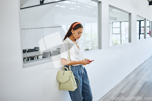 Image of Girl, student and phone in college by classroom window in university for email, learning or social media. Woman, education and smartphone for communication, blog or study on app, web or internet