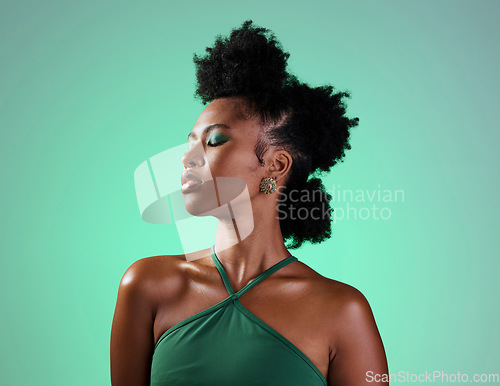 Image of Beauty in green, makeup or black woman portrait of sexy afro model with fashion, facial makeup or hair care with designer jewelry. Trendy, cosmetics art or edgy girl from Atlanta in studio