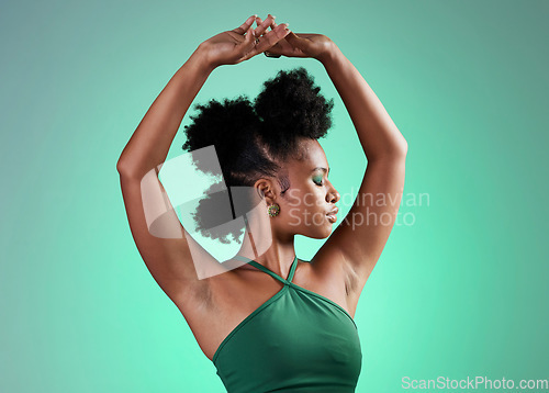 Image of Black woman, fashion and dance model pose of a person from Jamaica confident. Beauty and female empowerment of a salsa dancing and posing dancer with confidence in a studio with a green background