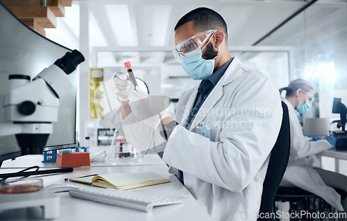 Image of Man, lab and research in science to study dna of virus with PPE for safety, wellness and health. Doctor, scientist or biologist work as team in laboratory, analysis of data and covid for healthcare