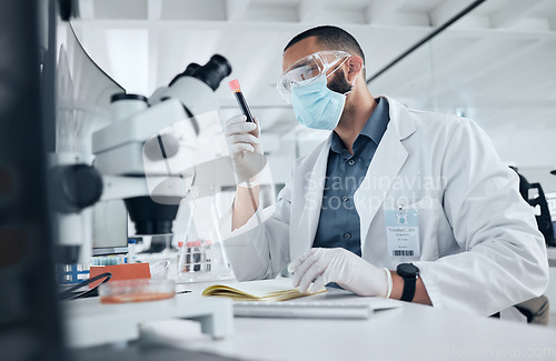 Image of Science, blood and covid esearch with a man engineer working in a lab on DNA for innovation, cure and vaccine. Medicine, healthcare and development with a scientist at work in a medical laboratory