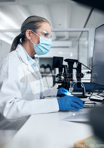 Image of Science woman, covid and computer laboratory research, medical innovation and expert test online. Senior scientist mask, desktop data and vaccine medicine worker planning virus analytics information