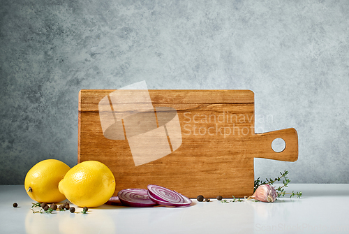 Image of still life with wooden cutting board and spices