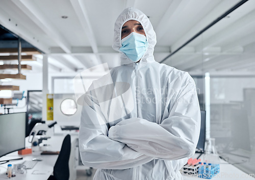 Image of Covid, safety and portrait of man in hazmat suit to protect against covid 19 pandemic, risk or corona virus. Ppe, face mask and medical healthcare worker, doctor or scientist in science laboratory