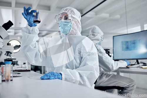 Image of Blood, covid and doctors in a science laboratory testing dna and rna to research, analysis and analyze the chemistry. Medical scientists in hazmat suit and safety mask working on vaccine innovation