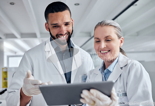 Image of Science, teamwork and tablet and scientist in laboratory for review on medical, vaccine and pharmacy investigation. Research, innovation and digital with woman and man working on healthcare medicine