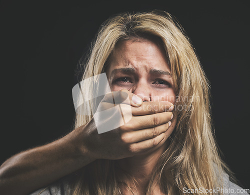Image of Woman, domestic violence and depression with hand on mouth for silence, gender abuse and sad in relationship. Model, distress and face cover by hand show inequality, anxiety and women fear