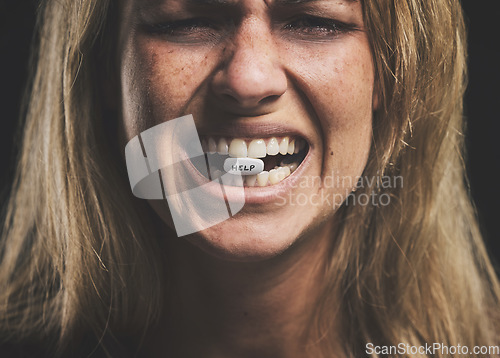 Image of Pills, sad and addiction woman with drug, mental health and overdose wanting help. Depression, pill and sick female suffering from pain, fear or danger with overdose of prescription drugs or medicine