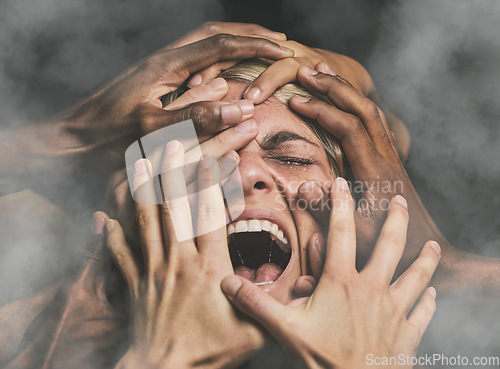 Image of Hands, face and woman abuse victim with fear, mental health and pain scared with smoke. Crying, angry and violence survivor screaming in studio with dark background with stress, alone and anxiety.