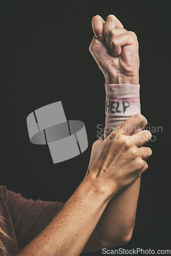 Image of Help, suicide and injury for hand of man with depression, mental health problem or anxiety. Dark fear, self harm fail and sad mentally ill person with pain, wrist bandage and depressed over life