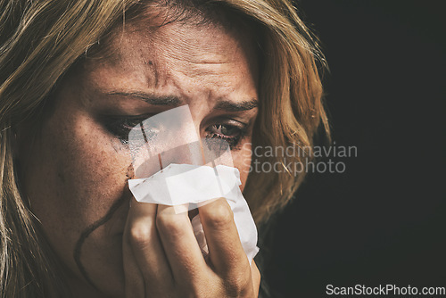 Image of Crying, depression and woman thinking of mental health problem against a black studio background. Face of a sad, frustrated and depressed person with running makeup, anxiety, stress about divorce