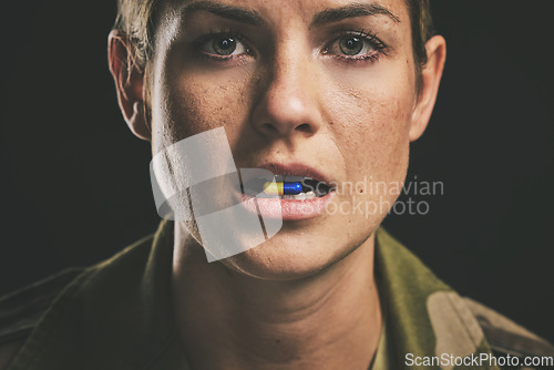 Image of Medicine, medical drugs and military woman with tablet in mouth for ptsd, depression or anxiety against black studio background. Portrait of a soldier with pills for stress and mental health