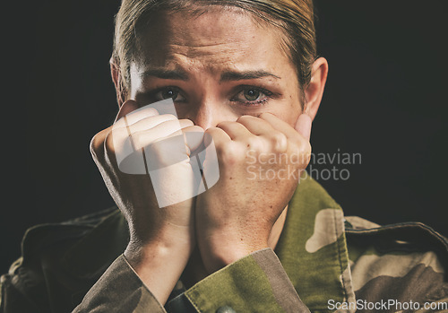 Image of Army, trauma and mental health struggle of a woman veteran from war and soldier work. Portrait of a military worker and hero crying with anxiety, stress fear and ptsd feeling emotional with tears