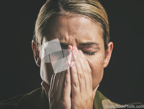 Image of Crying, depression and sad military soldier with stress from the army against a black studio background. Depressed, frustrated and veteran woman with ptsd trauma, anxiety and mental health problem