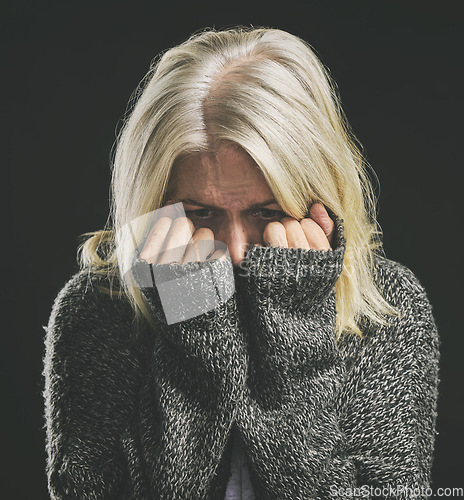 Image of Fear, mental health and dark depression for woman with social anxiety, scared mindset or personality disorder. Nervous breakdown, psychology or sad senior person with life problem on black background