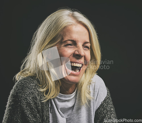 Image of Mental health, depression and woman with bipolar laughing in dark studio. Lady with schizophrenia, anxiety and mental illness with laugh expression. Mockup in psychology, addiction and rehabilitation