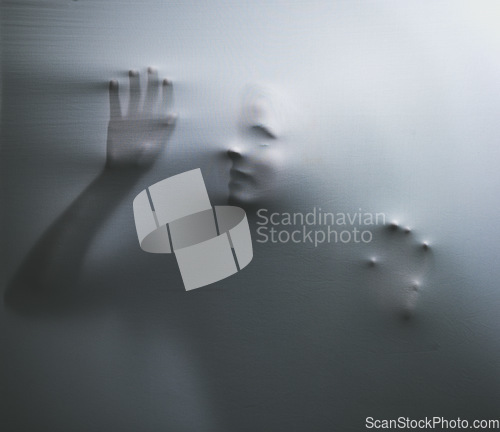 Image of Horror, fabric and hands of a woman trapped in textile trying to escape from nightmare. Curtain, help and bad dream with psychology female ghost, victim or spirit behind white material looking scary