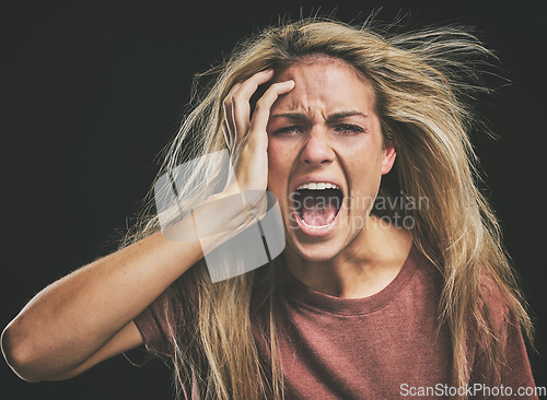 Image of Face, mental health and screaming woman headache, anxiety or stress. Psychology, bipolar or crazy, insane or depressed schizophrenia female, shouting or hearing voices alone on dark studio background