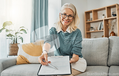 Image of Therapy documents, consultation and senior psychologist consulting with paperwork in office at a clinic. Portrait of a mature healthcare therapist asking for signature on contract during counseling