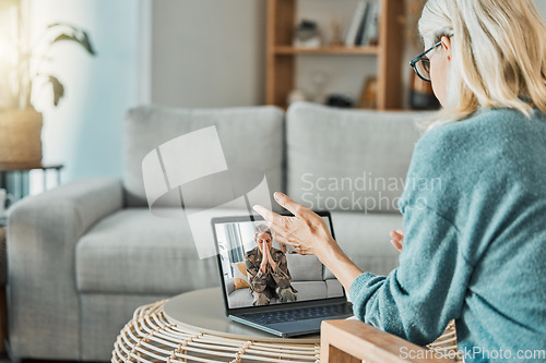 Image of Military woman in video call with psychologist for mental health problem, anxiety and trauma with laptop screen virtual technology. Soldier or veteran consulting with psychology therapy in zoom call