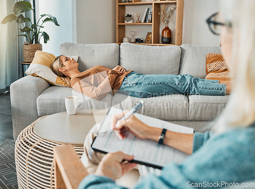 Image of Relax, psychology and therapist with woman patient struggling with depression resting on sofa. Professional psychologist analysis notes for consultation to help emotional mental health client.