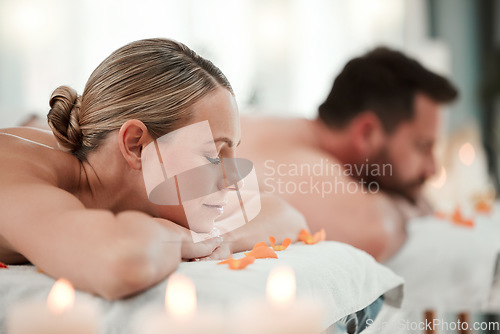 Image of Relax, spa and couple on massage bed table for luxury messaging, zen and calm on vacation in hotel resort. Health, body wellness therapy or body care treatment of man and woman on holiday together