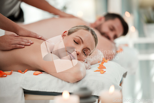 Image of Love, relax and couple at a spa for a massage to celebrate marriage, anniversary or birthday on holiday. Man and woman sleeping with luxury care and wellness therapy for body on vacation at a hotel