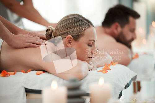 Image of Couple, spa massage or relax wellness in peace, healthcare or reiki hotel salon in self care, muscle tension or stress. Masseuse hands, woman or man on luxury honeymoon table bed in zen pamper space