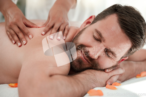 Image of Man, spa and back massage or relax wellness in peace, healthcare or luxury hotel in self care, muscle tension or stress. Masseuse hands on happy male on table bed in zen pamper from physical therapy