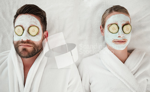 Image of Love, relax and couple at spa with face mask for luxury wellness treatment together from above. Professional skincare facial for self care detox and relaxation on cosmetic salon bed in Canada.
