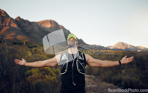 Image of Fitness, achievement and winner of a man in nature embracing freedom and victory in the outdoors. Active male in sports adventure, exercise and workout success for healthy wellness and fresh air