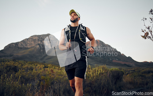 Image of Fitness man running exercises alone in nature outdoor on a sunny day. Muscular male runner with sportswear run with speed, endurance and cardio with strength training, hike or workout during sunset