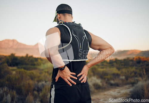 Image of Muscle, injury and back pain after a workout or running outdoor. Man holding lower back muscles in pain after exercise, hike and run. Accident, hurt and physical strain for backache during exercise