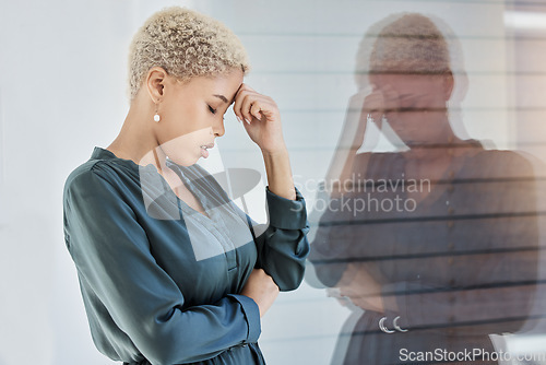 Image of Black woman, stress and work with mental health, tired and anxiety by window depressed in office. Professional, career and sad girl frustrated with headache, burnout and depression at job in New York